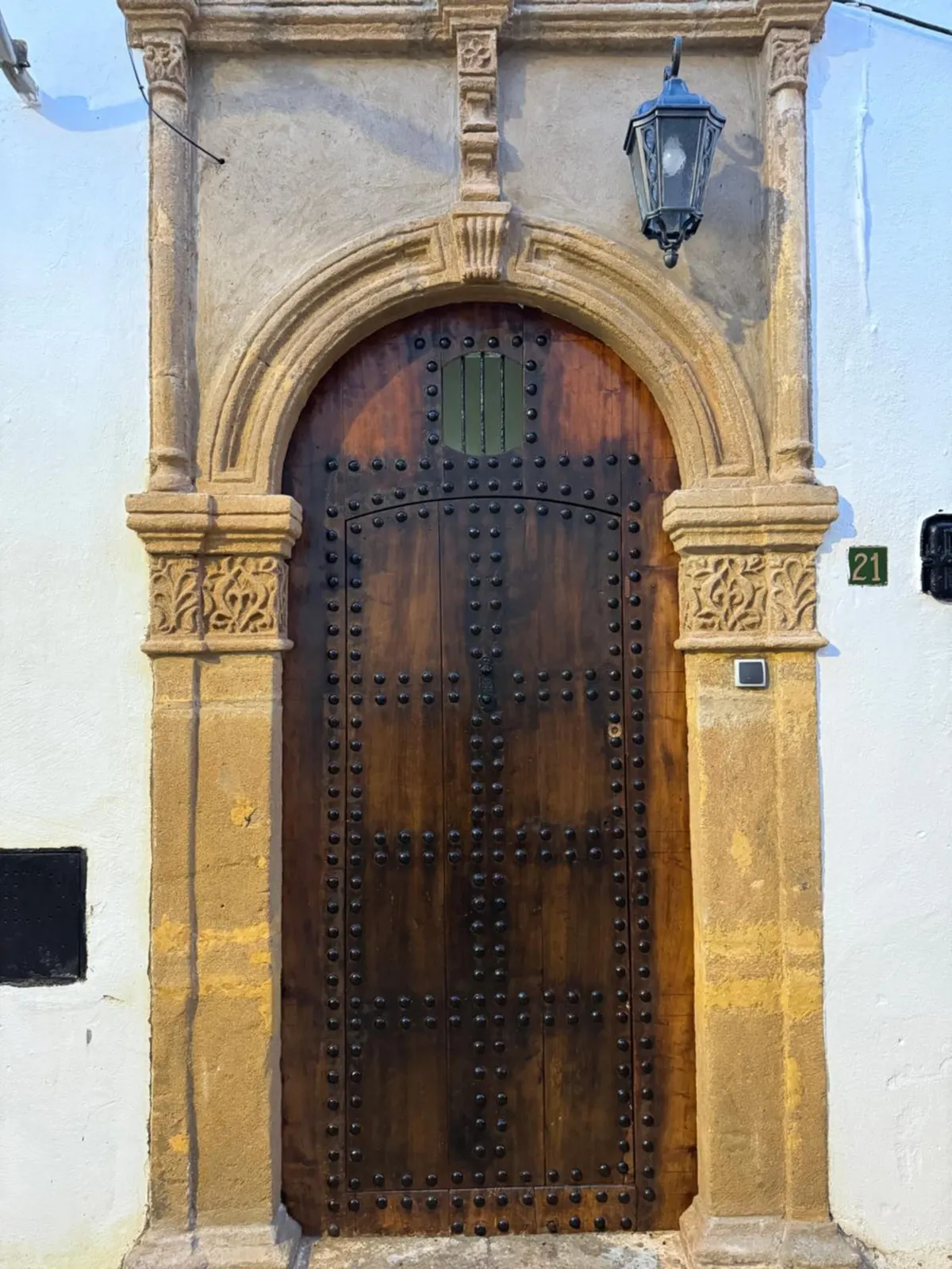 The carved sandstone doorway and studded door of Riad Jasmine